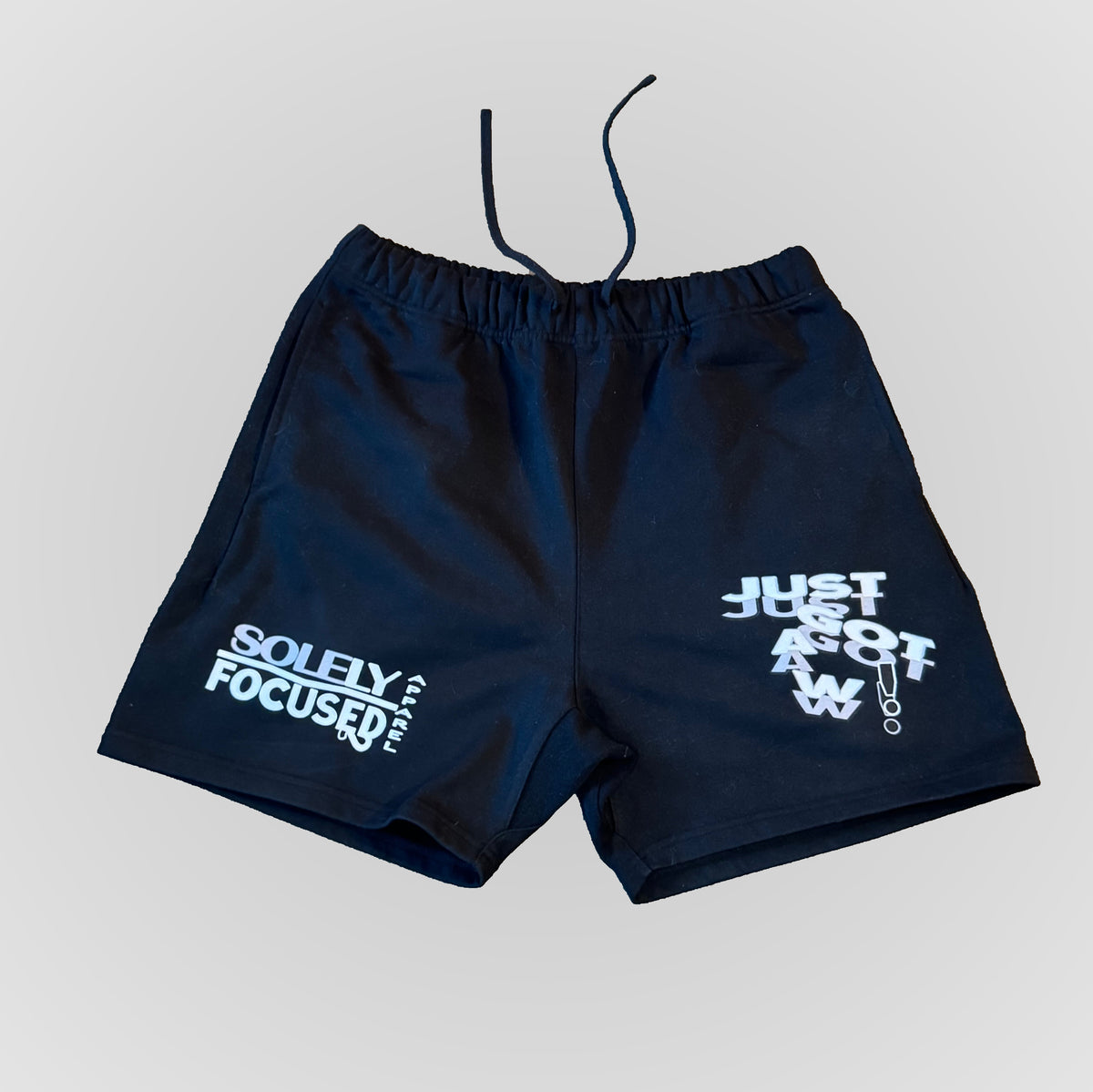 Dark blue shorts with elastic waistband and printed front and side graphics.