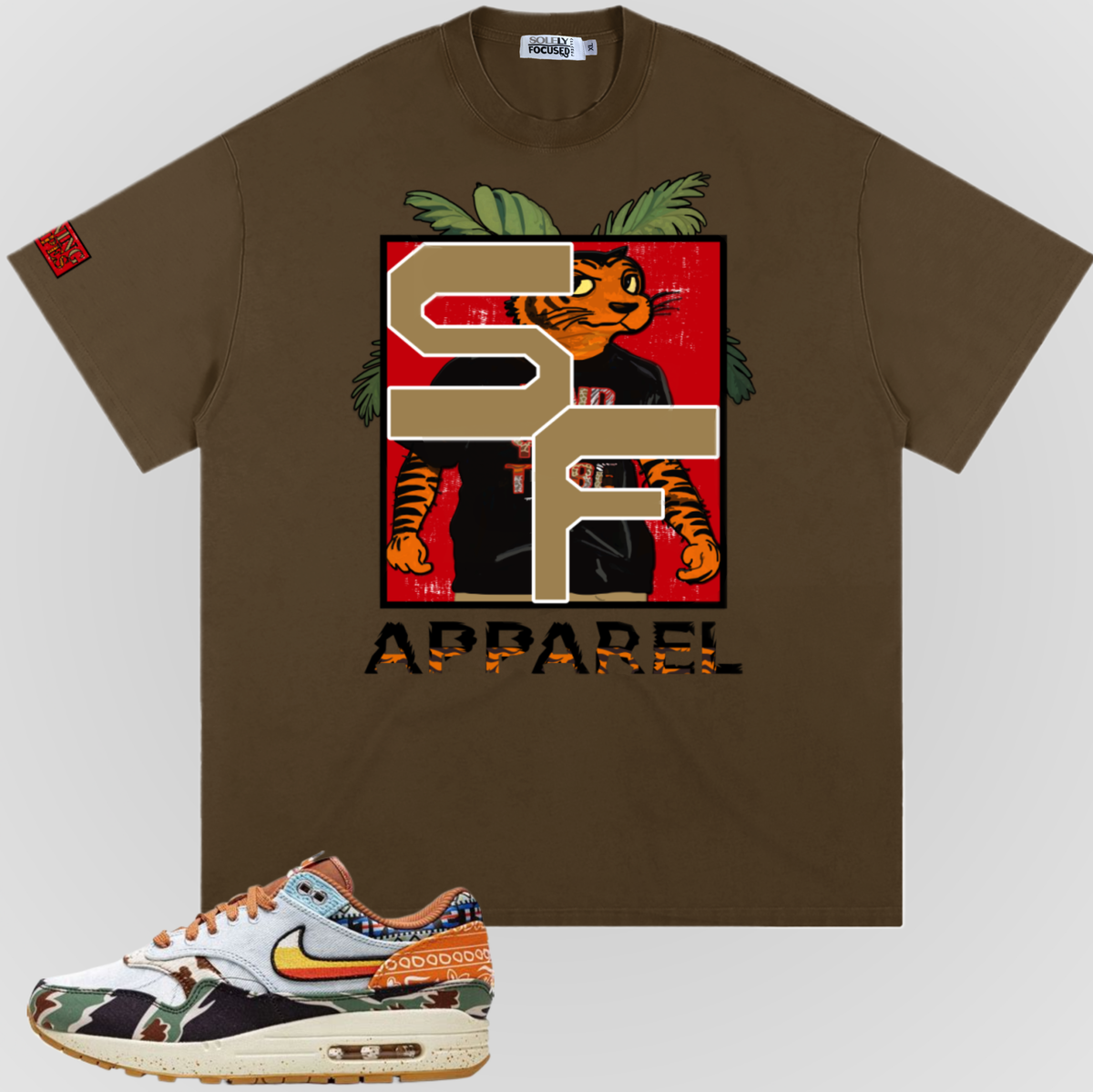 Brown Earning Stripes T-shirt with large front graphic and "APPAREL" text.