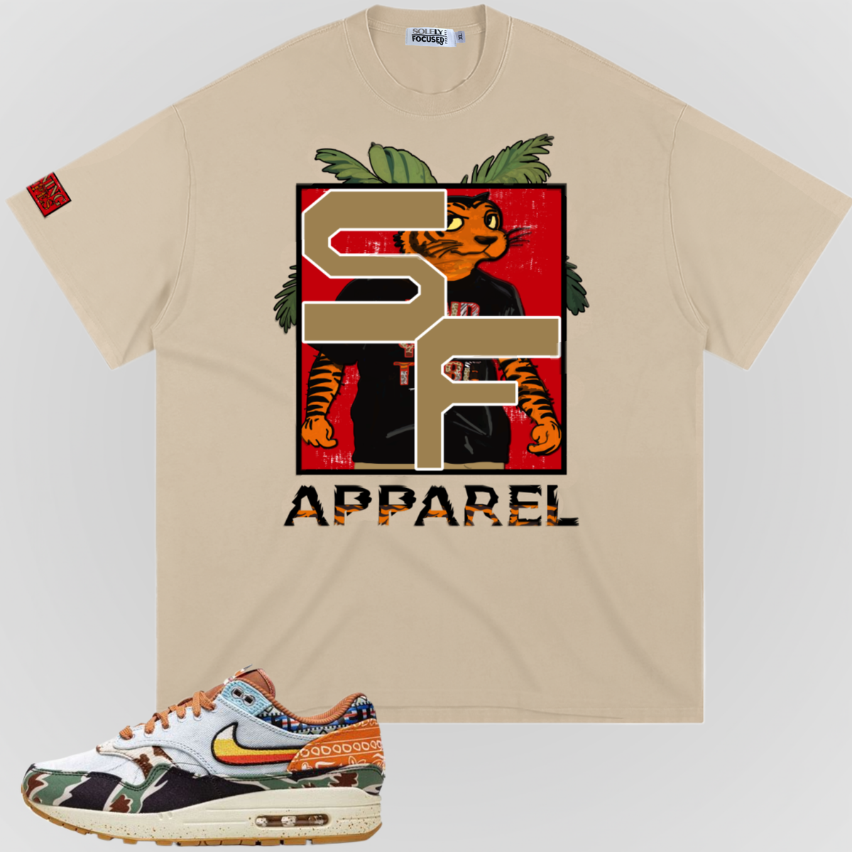 Khaki Earning Stripes T-shirt with large front graphic and "APPAREL" text.