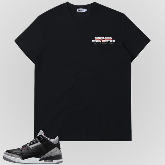Black T-shirt with small chest slogan text and logo above