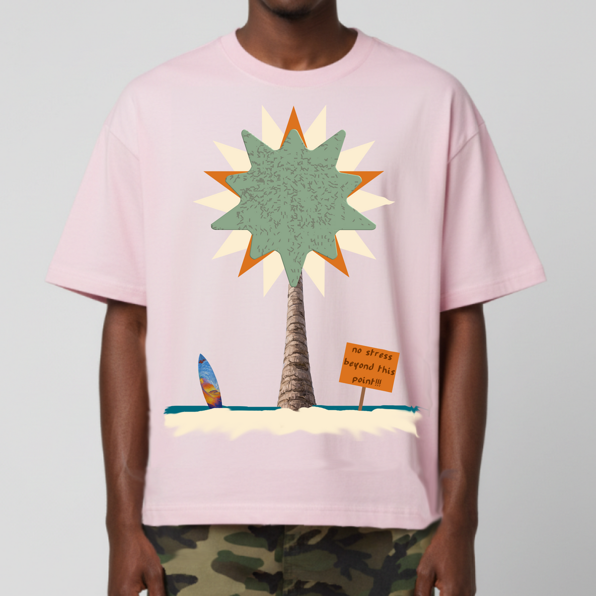 Pink cropped T-shirt with large palm tree graphic and slogan print