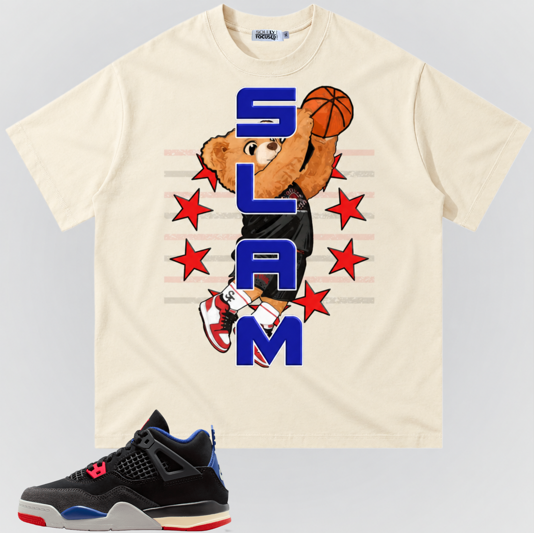 Mild apricot SLAM TEE with a basketball-dunking bear, blue SLAM lettering, and red stars, pictured above a black sneaker with red and blue accents.