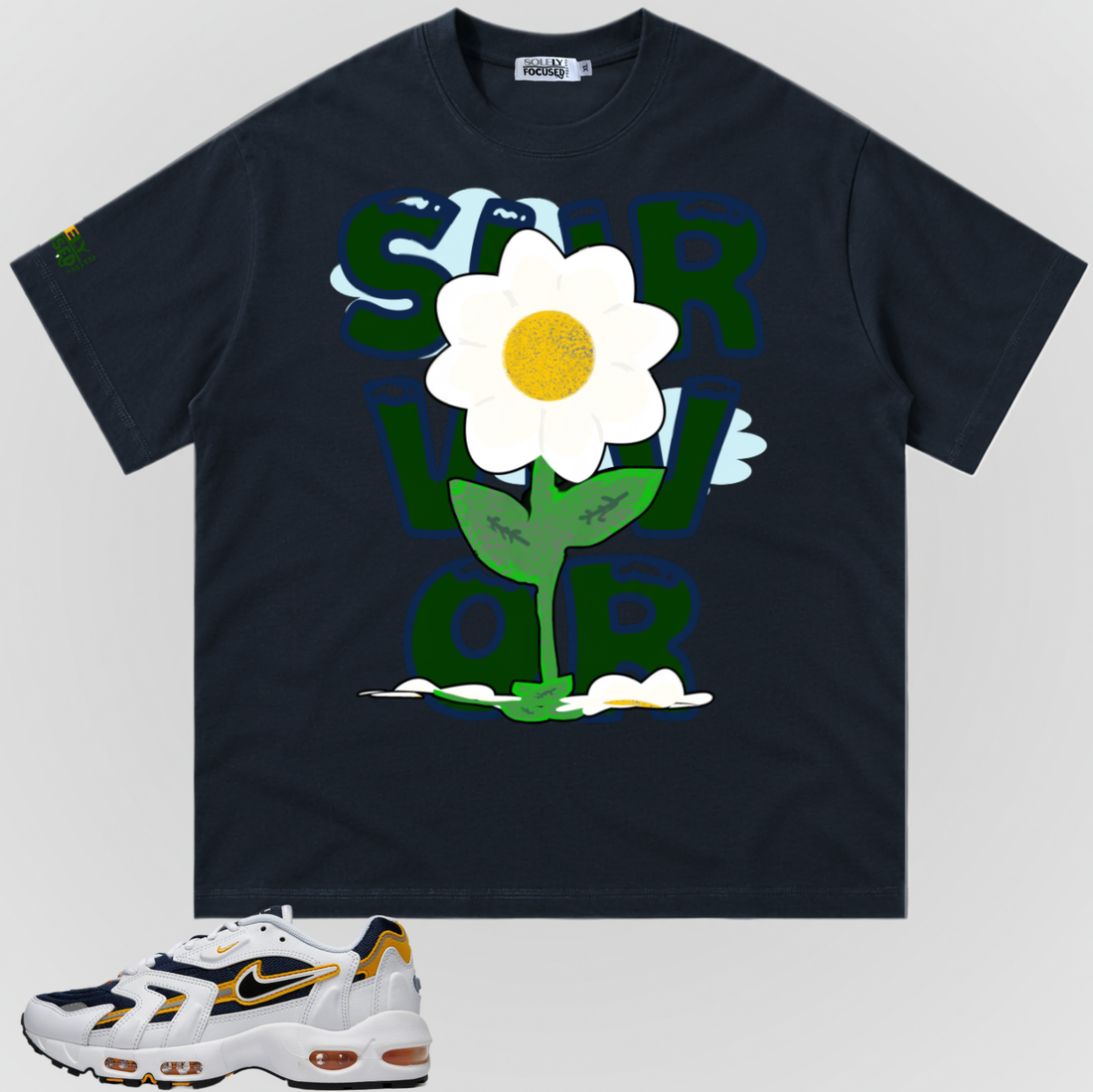 Navy SURVIVOR TEE with a standing white flower, yellow center, green stem, and fallen flowers, pictured above a white, navy, and yellow sneaker.